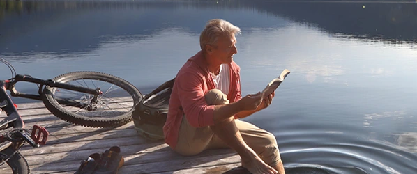 A man sitting on a dock